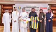 QIIB Chairman Sheikh Dr. Khalid bin Thani bin Abdulla Al-Thani, Al-Gharafa SC Club President Sheikh Jassim bin Thamer Al-Thani and other officials during the signing ceremony.
