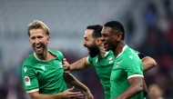Al Ahli's Sekou Yansane (right) celebrates with teammates.