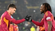Roma's Argentine forward #18 Matias Soule (L) celebrates after scoring his team's second goal with Roma's French midfielder #17 Manu Kone (R) during the Italian Serie A football match between As Roma and Sassuolo at the Olympic stadium in Rome on January 10, 2026. (Photo by Alberto PIZZOLI / AFP)