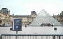 A photo shows an information panel notifying of the closure of the Louvre Museum on the empty plaza with the Louvre Pyramid, designed by Chinese-US architect Ieoh Ming Pei, as the museum is closed due a strike in Paris on January 12, 2026. Photo by Martin LELIEVRE / AFP