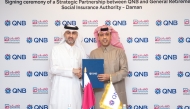 QNB Group CEO Abdulla Mubarak Al Khalifa and Director General of Daman Ahmed bin Ali Al Hammadi during the agreement signing.