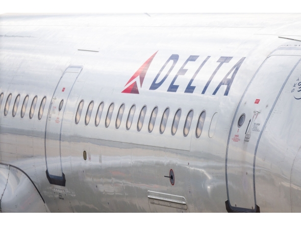 A Delta Airlines plane is stationed at a gate at the Austin-Bergstrom International Airport on January 12, 2026 in Austin, Texas. Photo by Brandon Bell / GETTY IMAGES NORTH AMERICA / Getty Images via AFP