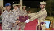 Deputy Chief of Staff for Education Maj. Gen. (Pilot) Salem Abdullah Al-Dosari distributing certificates to outstanding graduates.