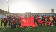 Team China pose for a photograph to celebrate qualifying to the knockout stage after the 2026 AFC U23 Asian Cup group D match between China and Thailand in Riyadh, Saudi Arabia, Jan. 14, 2026. (Xinhua/Wang Haizhou)