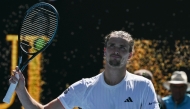 Germany's Alexander Zverev celebrates after his victory against Canada's Gabriel Diallo during their men's singles match on day one of the Australian Open tennis tournament in Melbourne on January 18, 2026. (Photo by Paul Crock / AFP)