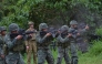 An Australian soldier (back L) supervises as Philippine Marines fire their weapons during a demonstration at Military Operation Urbanized Terrain (MOUTH) training exercises at the marine base in Ternate, Cavite province, southwest of Manila. File photo.