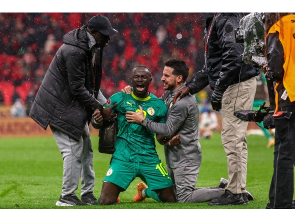 Senegal's forward #10 Sadio Mane and team members celebrate their victory at the end of the Africa Cup of Nations (CAN) final football match between Senegal and Morocco at the Prince Moulay Abdellah Stadium in Rabat on January 18, 2026. (Photo by FRANCK FIFE / AFP)