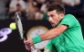 Serbia's Novak Djokovic hits a return to Spain's Pedro Martinez during their men's singles match on day two of the Australian Open tennis tournament in Melbourne on January 19, 2026. (Photo by DAVID GRAY / AFP)
