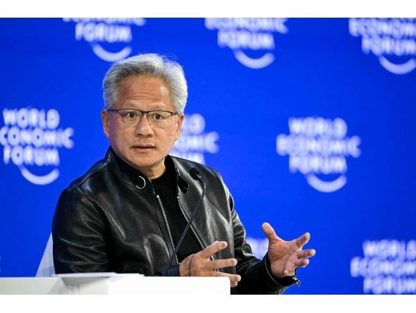 Nvidia founder and CEO Jensen Huang gestures as he speaks during the World Economic Forum (WEF) annual meeting in Davos on January 21, 2026. Photo by Fabrice COFFRINI / AFP