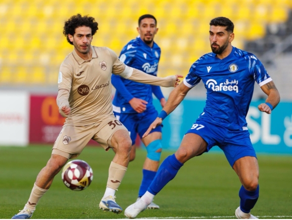 Action during the match between Al Rayyan and Al Khor.