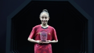 Qatar’s Racha Loghraibi poses with her trophy.