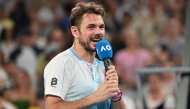 Switzerland's Stan Wawrinka gives an interview after losing to USA's Taylor Fritz in their men's singles match in Melbourne on January 24, 2026. (Photo by Paul Crock / AFP)