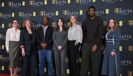 (L-R) BAFTA CEO Jane Millichip, Chair of BAFTA, Sara Putt, British actor David Jonsson, British actor Aimee Lou Wood, Chair of the Film Committee, Emily Stillman, Deputy Chair of the Film Committee, Anthony Andrews and Executive Director of Awards and Content, Emma Baehr pose for a picture at the announcement of the British Academy Film Awards (BAFTA) nominations in central London on January 27, 2026. (Photo by JUSTIN TALLIS / AFP)