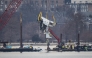 A crane removes airplane wreckage from the Potomac River on Feb. 3, 2025. Photo credit: Jabin Botsford/The Washington Post

