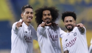 From left: Al Sadd's Roberto Firmino, Akram Afif and Claudinho celebrate after the win.