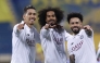 From left: Al Sadd's Roberto Firmino, Akram Afif and Claudinho celebrate after the win.