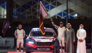 QMMF President Abdulrahman Al Mannai and Executive Director Amro Al Hamad with Nasser Saleh Al Attiyah and Candido Carrera during the ceremonial start. 