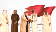 Senior Manager of the City Control and Smart Operations Center at Qatari Diar, Eng. Khalifa Al Mana, receiving the award from officials in Kuwait.
