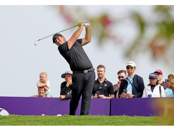 US golfer Patrick Reed plays a shot during the third day of the Qatar Masters at Doha Golf Club. 