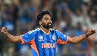India's Mohammed Siraj reacts after taking the wicket of USA's Saiteja Mukkamalla during the 2026 ICC Men's T20 Cricket World Cup group stage match between India and USA at the Wankhede Stadium in Mumbai on February 7, 2026. (Photo by Punit Paranjpe / AFP)
 