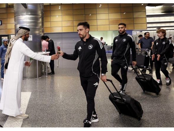 Sharjah players are welcomed upon their arrival in Doha.