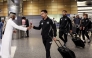 Sharjah players are welcomed upon their arrival in Doha.