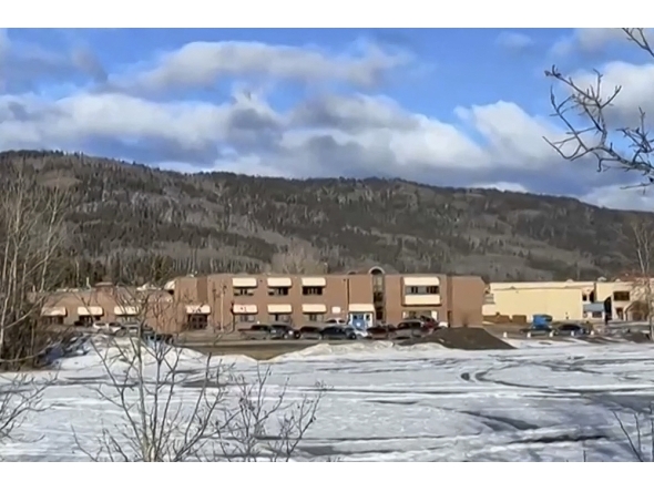 This screengrab of a video provided by local journalist Trent Ernst shows the middle school and high school building where a shooting took place, leaving at least nine people dead in the small town of Tumbler Ridge, British Columbia, on February 10, 2026. (Photo by Trent Ernst / AFP)
