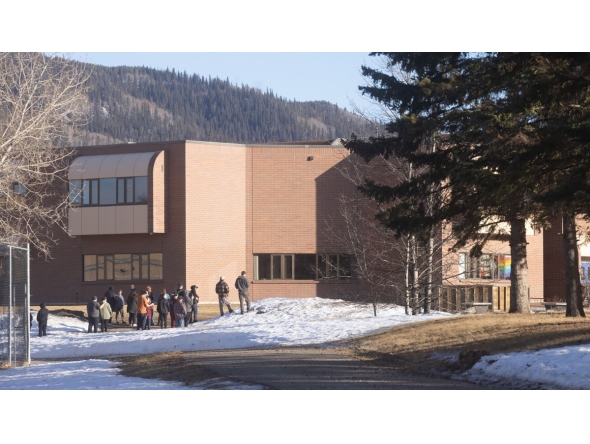 This photograph provided by local journalist Trent Ernst shows the middle school and high school building where a shooting took place, leaving at least nine people dead in the small town of Tumbler Ridge, British Columbia, on February 10, 2026. (Photo by Trent Ernst / AFP)