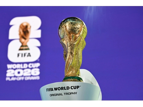 (Files) This photograph shows the 2026 FIFA World Cup trophy following the 2026 FIFA World Cup European Play-Off draw at the FIFA's Home of Football in Zurich on November 20, 2025.(Photo by Fabrice Coffrini / AFP)