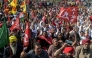 Farmers and trade union workers shout slogans during a nationwide strike over government policies and other issues in Amritsar on February 12, 2026. (Photo by Narinder Nanu / AFP)