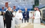 UDST President Dr. Salem Al-Naemi at the University's booth with other officials and participants. 