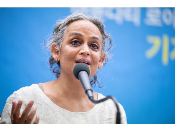 (Files) Indian author Arundhati Roy speaks during a press conference in Seoul on November 25, 2021. (Photo by Anthony Wallace / AFP)