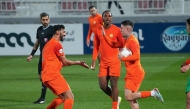 Umm Salal players celebrate a goal during match against Al Ahli. 
