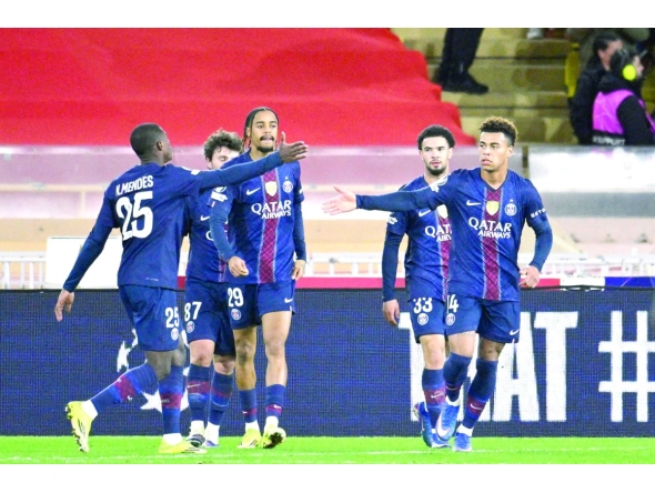Desire Doue (right) celebrates with teammates after scoring Paris Saint-Germain’s third goal against Monaco.