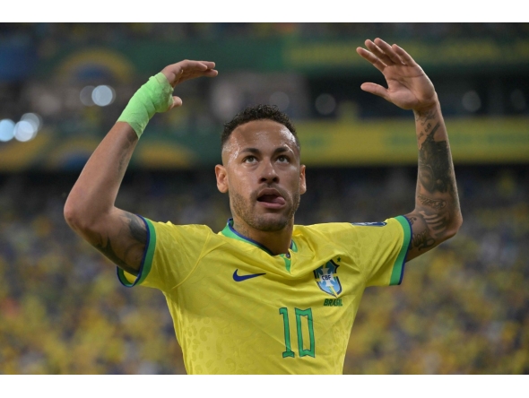 (FILES) Brazil's forward Neymar gestures during the 2026 FIFA World Cup South American qualification football match between Brazil and Venezuela at the Arena Pantanal stadium in Cuiaba, Mato Grosso State, Brazil, on October 12, 2023. (Photo by NELSON ALMEIDA / AFP)