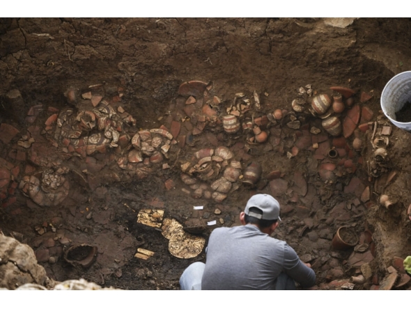 This handout picture released by Panama Ministry of Culture shows an archaeologist working inside a pre-Hispanic tomb approximately 1,200 years old, discovered at the El Cano Archaeological Park in Cocle, panama, on February 20, 2026. (Photo by Handout / panama / AFP)