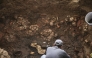 This handout picture released by Panama Ministry of Culture shows an archaeologist working inside a pre-Hispanic tomb approximately 1,200 years old, discovered at the El Cano Archaeological Park in Cocle, panama, on February 20, 2026. (Photo by Handout / panama / AFP)