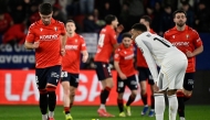 Real Madrid's French forward #10 Kylian Mbappe reacts to Osasuna's second goal scored by Spanish forward #09 Raul Garcia during the Spanish league football match between CA Osasuna and Real Madrid CF at El Sadar Stadium in Pamplona on February 21, 2026. (Photo by ANDER GILLENEA / AFP)