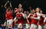 Arsenal celebrate their victory at the end of the English Premier League football match between Tottenham Hotspur and Arsenal at the Tottenham Hotspur Stadium in London, on February 22, 2026. (Photo by Glyn KIRK / AFP)