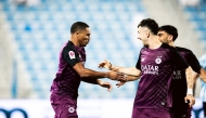 Pedro Miguel (left) celebrates with teammate Rafa Mujica after scoring Al Sadd's opening goal.