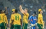 India’s captain Suryakumar Yadav (second right) walks off the field as South Africa’s players celebrate his dismissal.