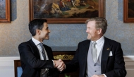 Netherlands' King Willem-Alexander (R) shakes hands with Prime Minister Rob Jetten during the signing of the Royal Decrees in the Meeting Room at Huis ten Bosch Palace for the swearing-in ceremony of the new cabinet in The Hague, The Netherlands on February 23, 2026. (Photo by Koen van Weel / ANP / AFP)
