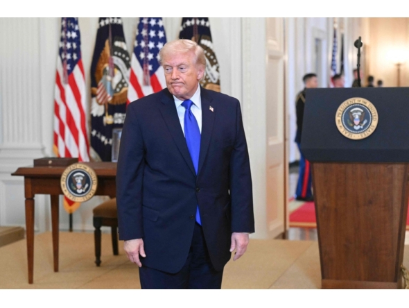 US President Donald Trump reacts as he departs during the Angel Families Remembrance Ceremony in the East Room of the White House in Washington, DC, on February 23, 2026. (Photo by Saul Loeb / AFP)