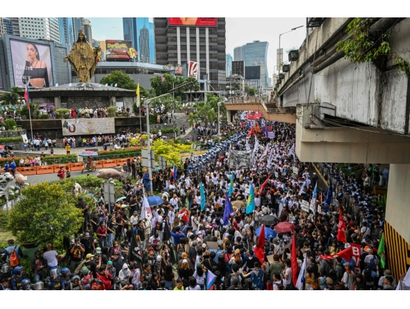 Protesters march during an anti-corruption rally that coincides with the 40th anniversary of the EDSA People Power Revolution, in Quezon City on February 25, 2026. (Photo by Jam Sta Rosa / AFP)