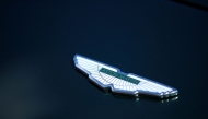The Aston Martin emblem is pictured during the Concours of Elegance at Hampton Court Palace, south west of London on September 5, 2025. Photo by Rhianna Chadwick / AFP