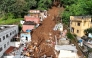 In this aerial view rescuers search for victims amid the rubble and mud of a house after a landslide triggered by heavy rains in the Paineiras neighborhood in Juiz de Fora, Minas Gerais State, Brazil, on February 25, 2026. Photo by Pablo PORCIUNCULA / AFP