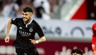 Rafa Mujica (left) celebrates after scoring Al Sadd's second goal.