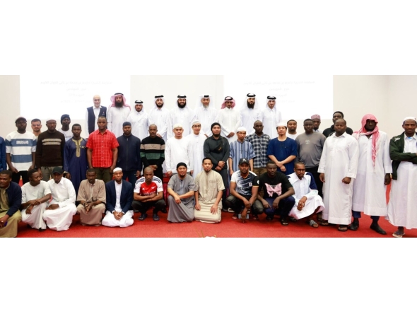 Officials with participants during the honouring ceremony. 