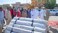 Ambassador of Qatar to Sudan H E Mohamed bin Ibrahim Al-Sada with other officials at the distribution centre of shelter tents.