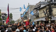 Supporters of the Rastriya Swatantra Party (RSP) celebrate outside the counting centre at Damak in Jhapa district on March 7, 2026. (Photo by Prakash Mathema / AFP)